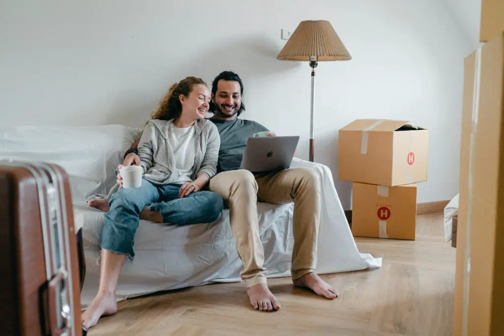 happy-couple-spending-time-together-on-sofa-after-moving