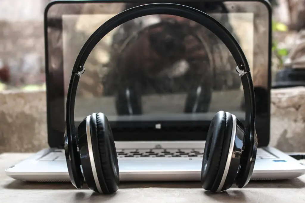 best online transcription jobs photo-of-black-wireless-headphones-in-front-of-the-laptop