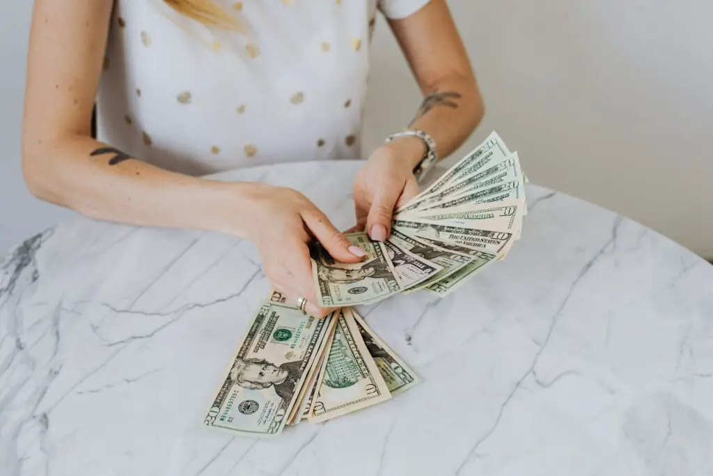 what to do with 50k crop picture of woman holding money