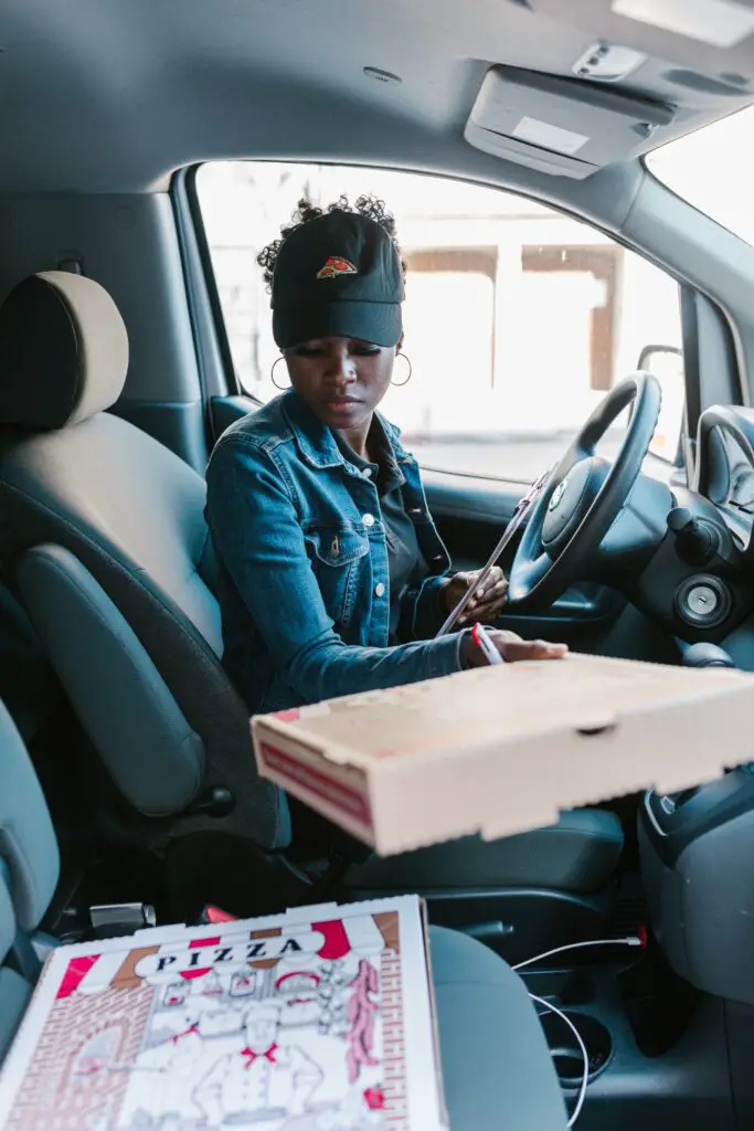 photo of pizza delivery woman